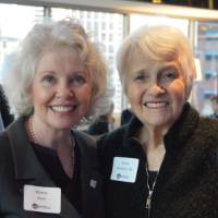 Marcia Haas smile for a photo together with an alumna